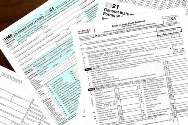 What documents must be included in your paper tax return?